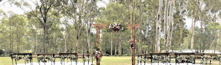 Four post arbour and seating by SECRET WEDDING EVENTS. FLORABUNDA added some native pretties…