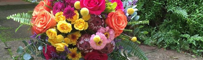 Beautiful bright bouquet and all fresh foliage table runners at Cedar Creek Lodges of…